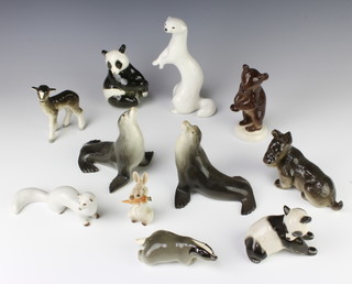 A Russian porcelain figure of a standing bear cub 13cm and 10 other Russian figures

