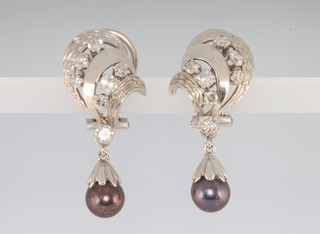 A pair of white gold, grey pearl and diamond whorl earrings ensuite to the preceding lot 