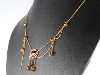A yellow gold and garnet necklace 5.5 grams
