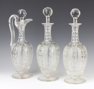 A pair of Edwardian mallet shaped decanters and stoppers 32cm and a matching ewer (cracked handle)
