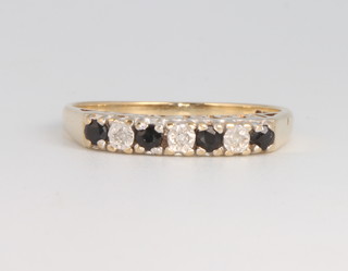 A 9ct yellow gold sapphire and diamond ring size M 