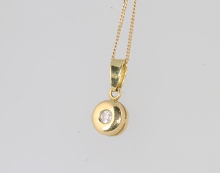 An 18ct yellow gold diamond set pendant and chain 
