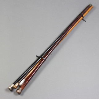 An ebony walking cane with silver knop three others