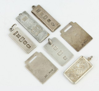 Seven silver pendants, 92 grams