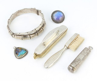 A silver bangle and minor silver items, 72 grams 