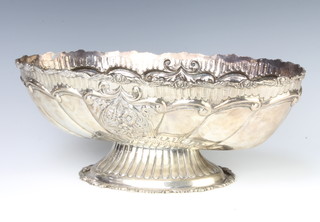 A Continental 900 standard repousse oval fruit bowl decorated with flowers, 39 cm, 1245 grams 