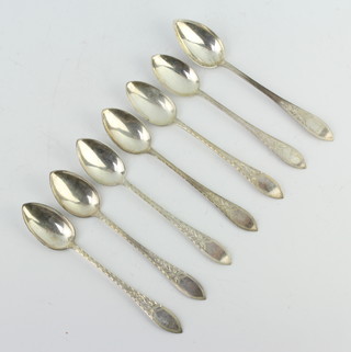 Seven Continental silver teaspoons with bright cut decoration 76 grams