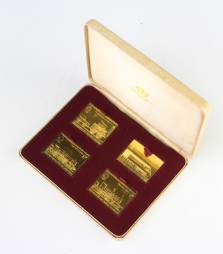 Four silver gilt stamps, 107 grams, cased
