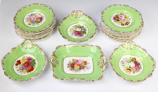 An Edwardian Copeland dessert service with green and gilt rims enclosing painted floral sprays, comprising 19 plates, 3 scalloped dishes and 1 rectangular dish 