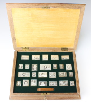 A set of silver commemorative stamps, cased, 482 grams