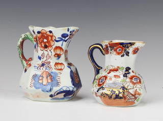 A pair of Victorian ironstone jugs decorated in the chinoiserie style 13cm and 17cm, the larger jug is chipped 