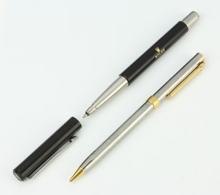 A Tiffany & Co steel cased and gilt metal mounted propelling pencil and a Parker ballpoint pen, case marked Rolex 
