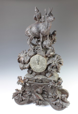 A carved Swiss clock case surmounted by a figure of a goat, the base decorated acorns and 2 game birds, the original movement has been replaced with a quartz movement 80cm h x 51cm w x 20cm d 
