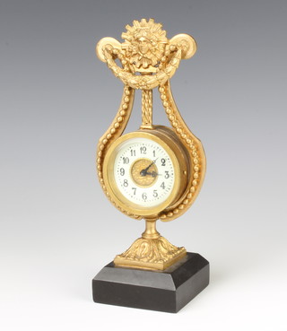 A French timepiece with enamelled dial and Arabic numerals contained in a gilt metal lyre shaped case, raised on a stepped marble base 