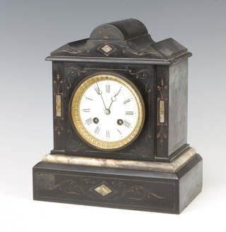 A Victorian French 8 day striking mantel clock with enamelled dial contained in a black and white marble veined case complete with pendulum 