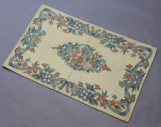 A Kashmiri woolwork stitched panel with floral medallion to the centre 124cm x 78cm 