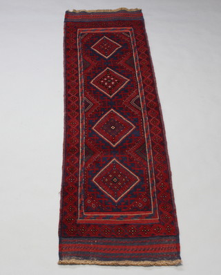 A red and blue ground Meshwani runner with 4 octagons to the centre within a multi row border 235cm x 68cm 