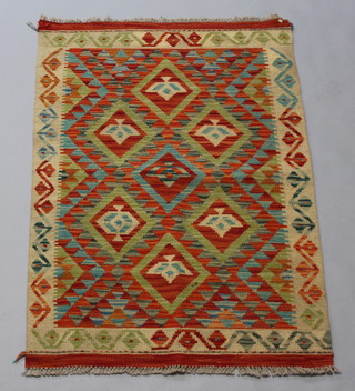 A yellow, green and orange ground Chobi Kilim rug 117cm x 87cm 