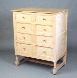 A Heals White Spot 17th Century style limed oak chest of 2 short and 3 long drawers, raised on turned and block supports 107cm h x 90cm w x 53cm d 