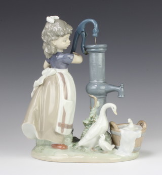A Lladro figure of a girl at a water pump with a family of geese at her feet 23cm 