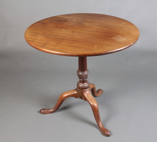 A Georgian circular mahogany snap top tea table raised on a turned column and tripod base 70cm h x 76cm diam. 