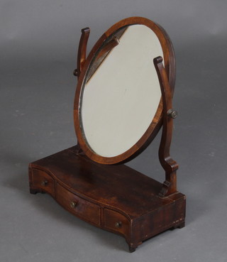 A 19th Century oval plate dressing table mirror contained in a mahogany swing frame, the base of serpentine outline fitted 1 long and 2 short drawers raised on bracket feet 54cm h x 43cm w x 20cm d 