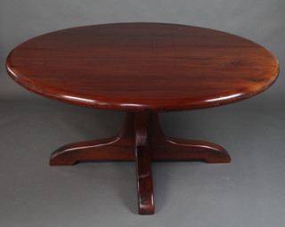 A Railantique Harare Zimbabwe hardwood dining room suite comprising circular pedestal dining table raised on a cruciform base 82cm h x 159cm diam. together with a set of 8 stick and rail back dining chairs with woven hide seats, the base of the table labelled Railantique Harare Zimbabwe 1987 626 2011 
