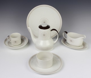A Royal Doulton Morning Star coffee and dinner service comprising 10 coffee cups, 10 saucers, 5 medium plates, 14 small plates, 6 dinner plates, sugar bowl, 4 dessert bowls, a coffee pot, milk jug, 2 sauce boats and stands, a tureen and lid, a spare lid and an oval meat plate 