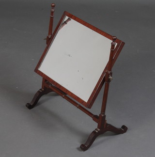 A Georgian rectangular plate dressing table mirror contained in a mahogany swing frame 50cm h x 43cm w x 25cm d 