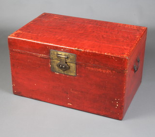 A Chinese red lacquered trunk with hinged lid and brass fittings 43cm h x 76cm w x 49cm d 