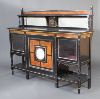 A Victorian ebonised and amboyna sideboard with raised mirrored back fitted a cupboard enclosed by a panelled door with "Wedgwood" plaque to the centre flanked by a pair of cupboards above 3 recesses 137cm h x 175cm w x 41cm d 
