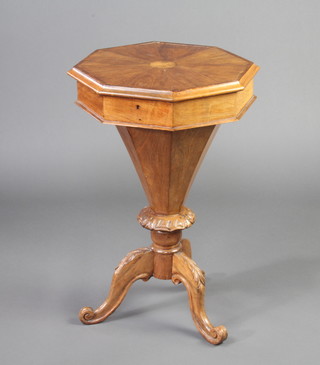 A Victorian octagonal work table of conical form and fitted interior, raised on carved pillar and tripod base 72cm h x 46cm w x 46cm d 