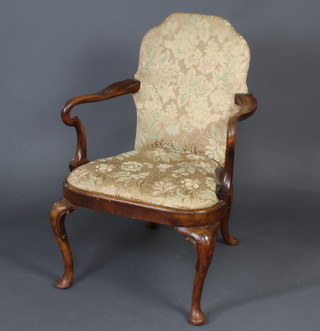 A 1920's Queen Anne style walnut open armchair raised on cabriole supports with upholstered back and drop in seat 