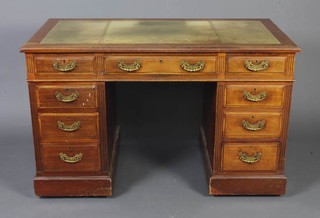 A mahogany kneehole desk with inset green writing surface above 1 long and 8 short drawers 75cm h x 123m w x 68cm d  