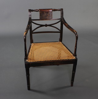 A Regency style lacquered bar back bedroom chair with X framed back and woven cane seat, raised on turned supports 