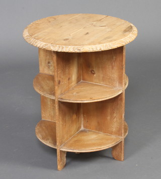 A 1920's circular carved oak occasional table the base fitted with segments 60cm h x 52cm diam. 