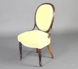 A 19th Century French walnut salon chair raised on turned and fluted supports upholstered in mint green dralon 