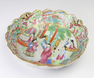 A late 19th Century famille rose shaped dish decorated figures on a pavillion terrace, 27cm 