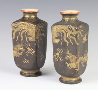 A pair of black ground Satsuma vases decorated with dragons chasing the flaming pearl 16cm 