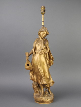 An Art Nouveau French spelter figure Mignon, converted to a table lamp 52cm h 