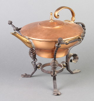 An Art Nouveau dresser style copper tea kettle, raised on a wrought iron stand, the kettle handle marked RD93257 (burner missing) 