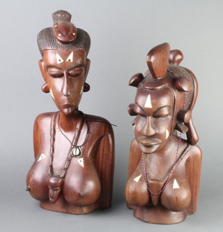 A pair of African hardwood and inlaid bone portrait busts of ladies 49cm h x 24cm w x 16cm d 