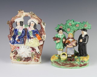 A 19th Century Staffordshire arbour group 19cm together with a Staffordshire group beneath a tree 15cm 