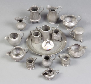 A circular pewter plate marked Barkers 25cm diam., an English Pewter planished pewter cream jug, 11 planished pewter cream jugs, 3 pewter measures, miniature pewter tankard   