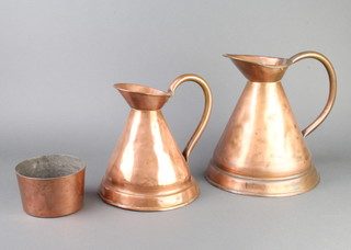 A 19th Century unmarked circular copper jelly/ice cream mould 8cm x 13cm and 2 unmarked copper harvest measures 28cm and 23cm (both with dents)  