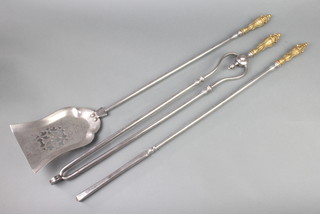 A Regency polished steel and brass 3 piece fireside companion set comprising poker, shovel and tongs  