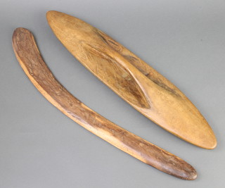 An Aboriginal boomerang 65cm x 4cm and a ditto shield 61cm x 15cm 