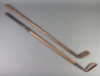 A "The Mascot" hickory shafted putter, the head marked The Mascot, hand forged R Eickle Portsmouth Special, together with 1 other unmarked putter 
