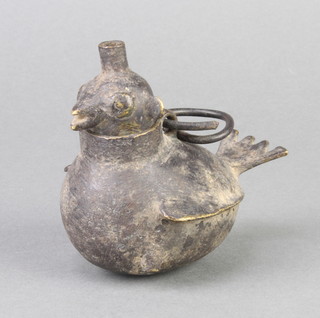 A Persian bronze oil lamp in the form of a bird 8cm x 11cm 