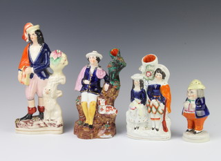 A Staffordshire pottery pepperette in the form of a standing gentleman 14cm together with 3 Staffordshire figure groups 